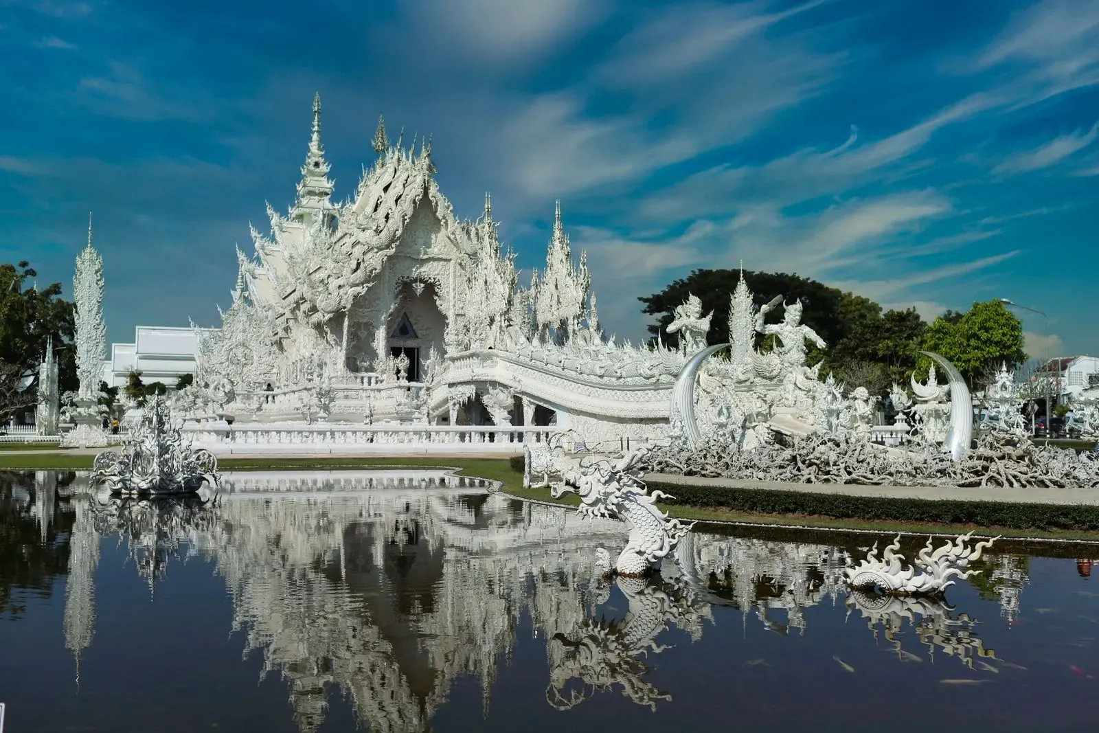 The White Temple’s main hall and bridge reflected in its pond