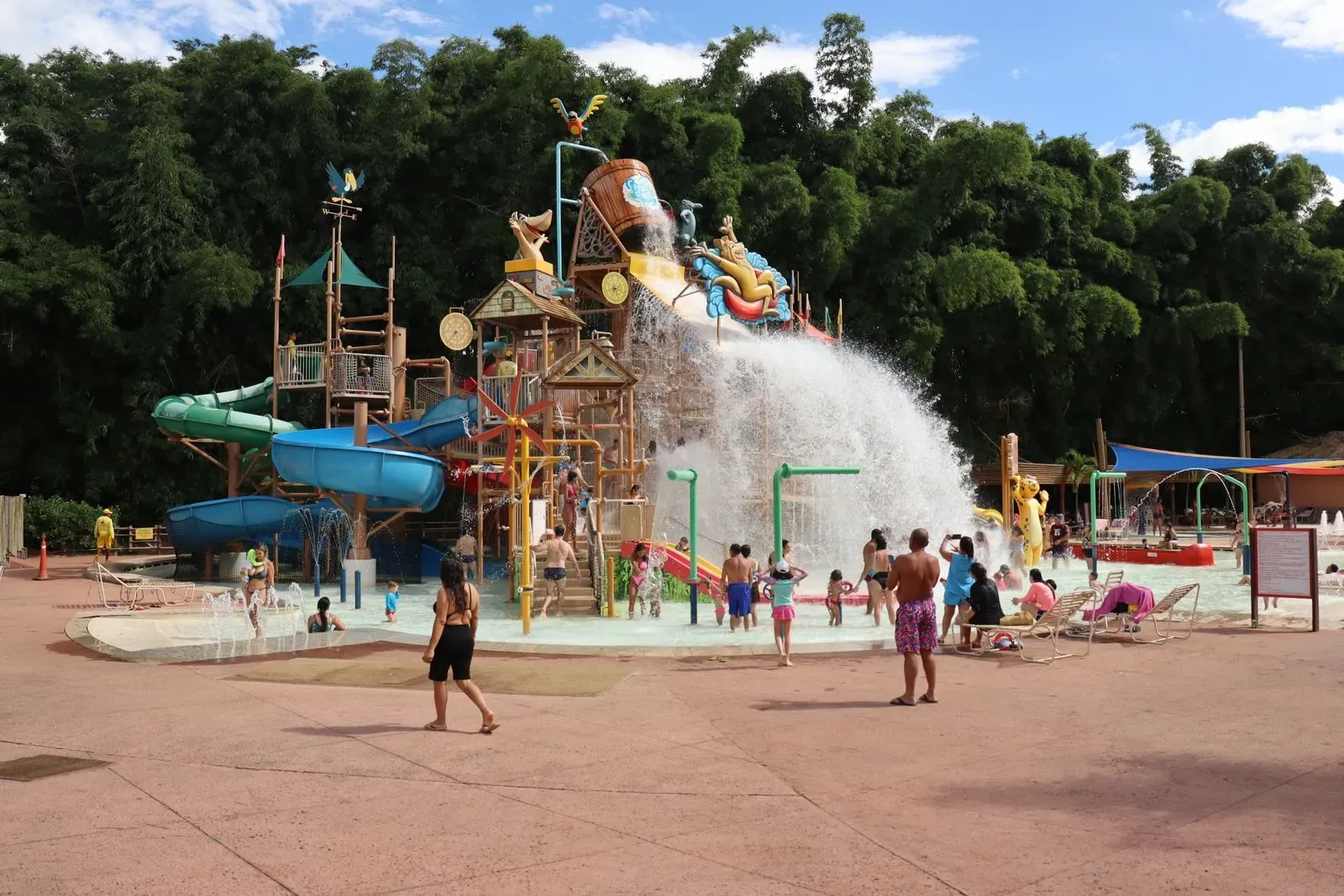 A kids’ splash zone with a tipping water bucket